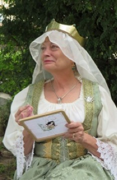 Image of Melisande de Frayne doing embroidery